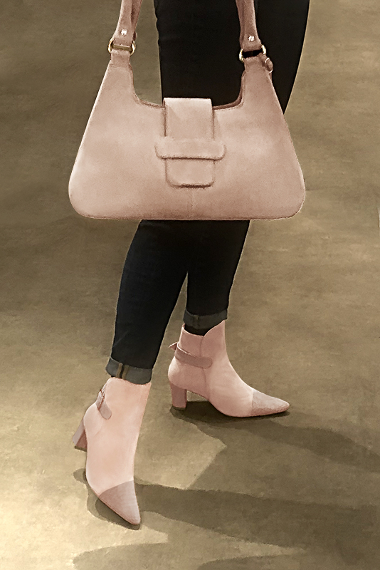 Powder pink women's ankle boots with buckles at the back. Tapered toe. Medium block heels. Worn view - Florence KOOIJMAN